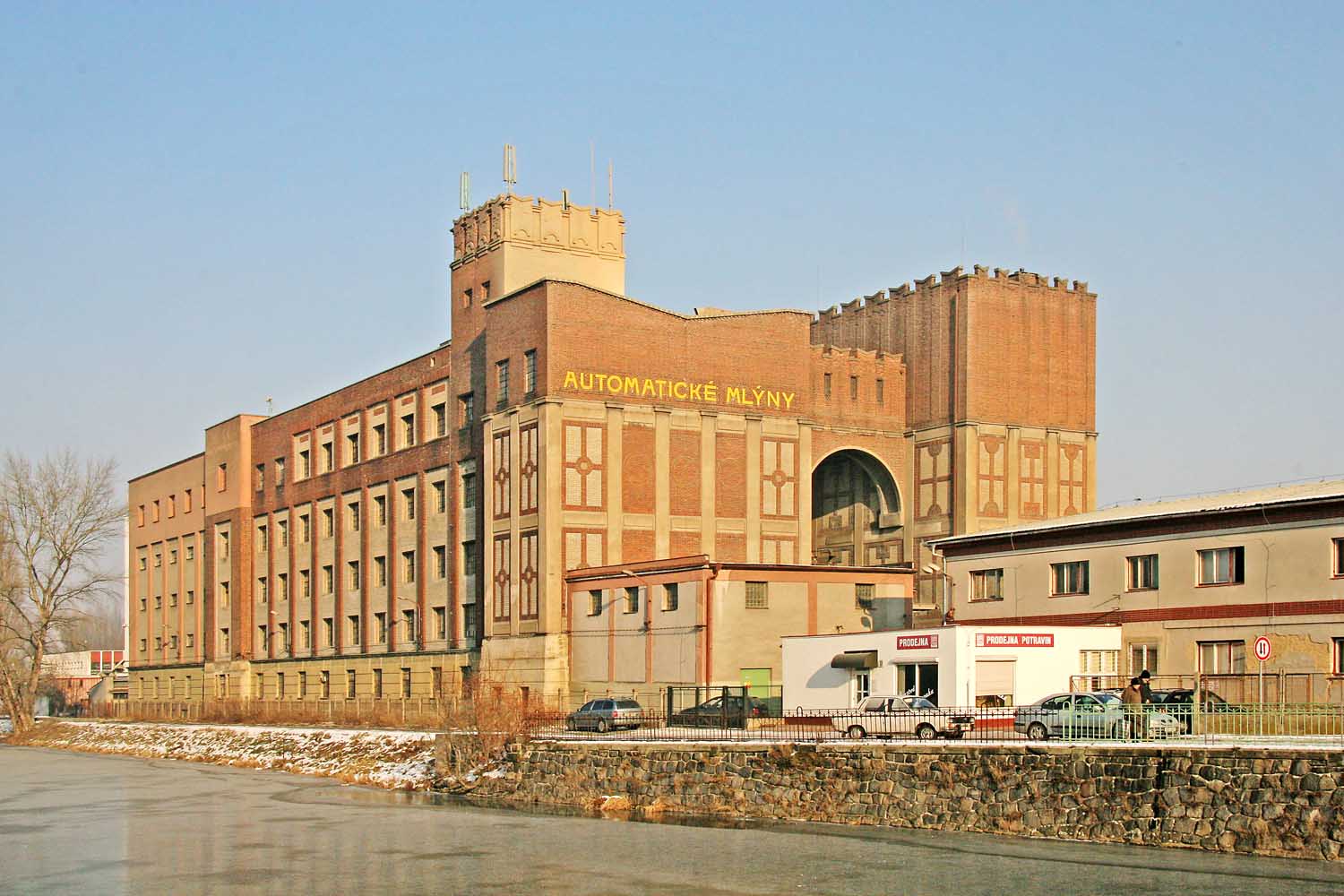 Automaticke mlyny brick facade with Ishtar Gate inspired design