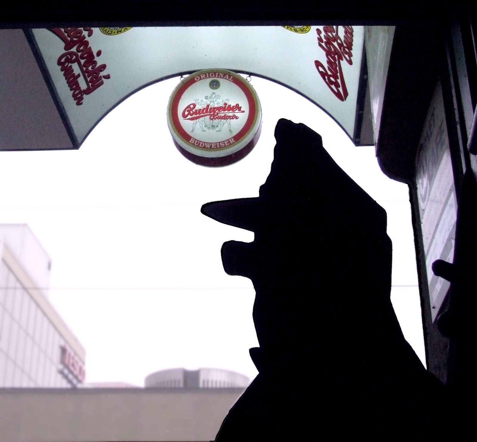 Silhouette of Good Soldier Svejk statue outside a Prague pub