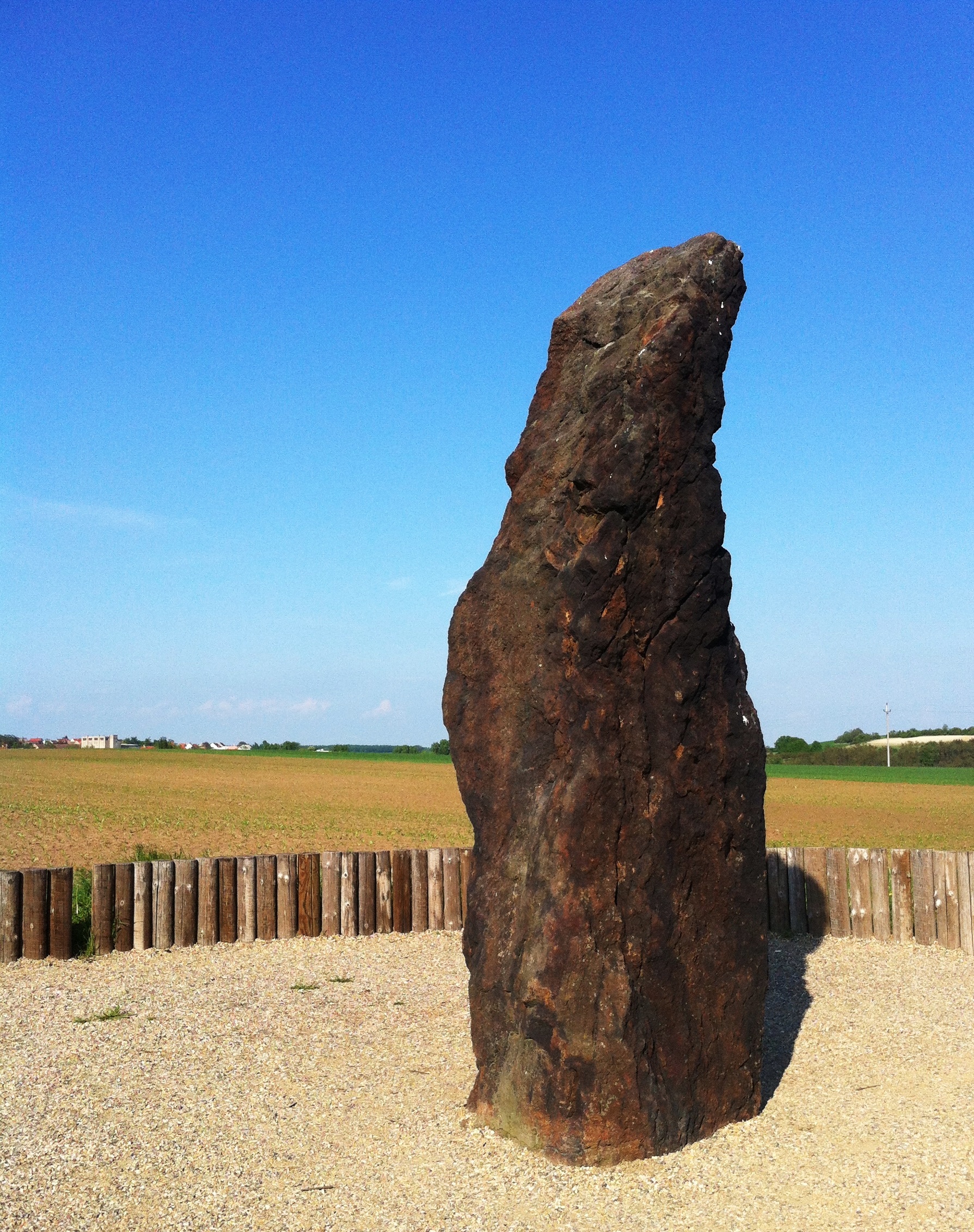 The Kamenny pastyr menhir standing alone in a field