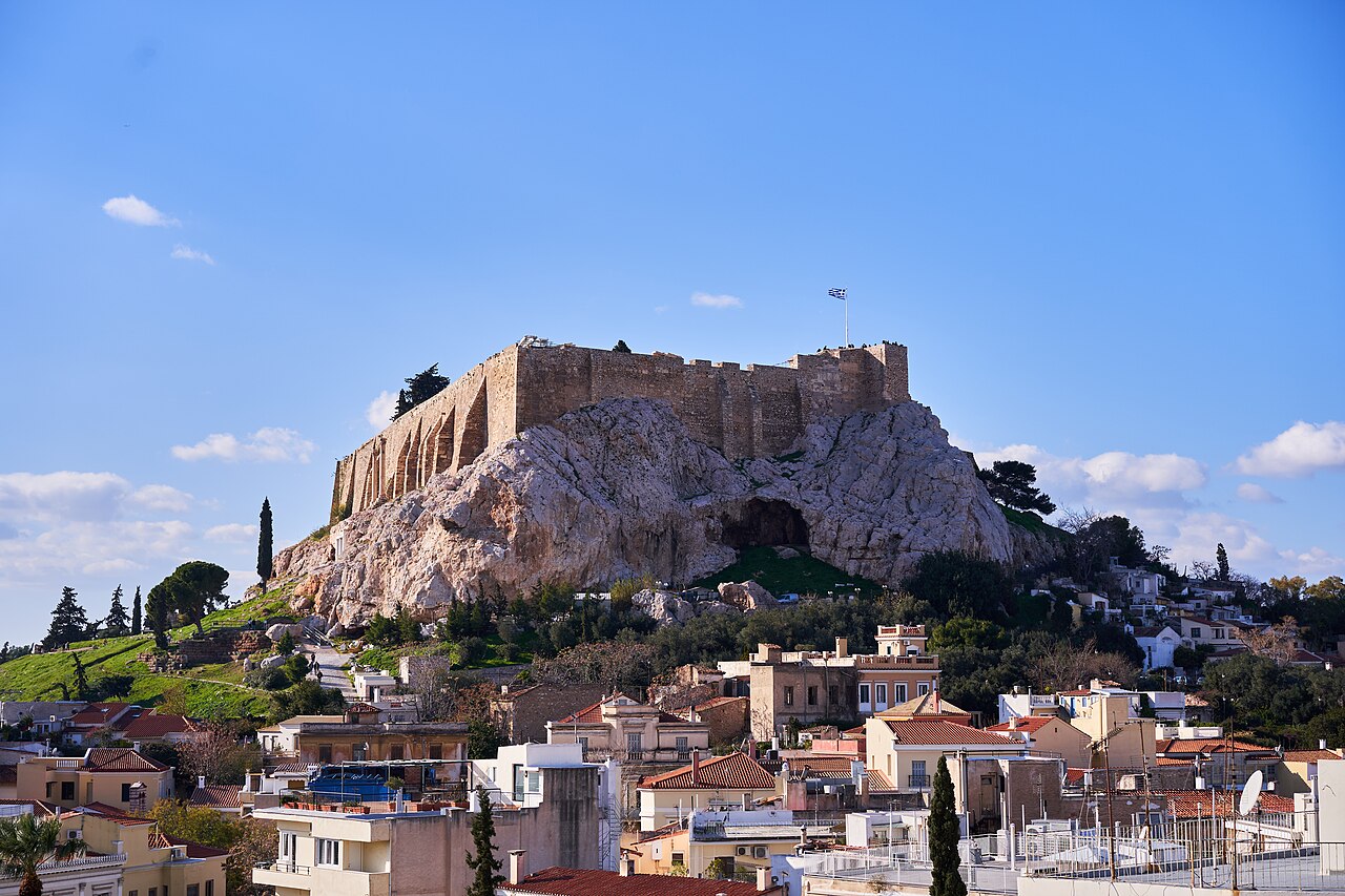 Plaka neighborhood in Athens with colorful buildings beneath the Acropolis