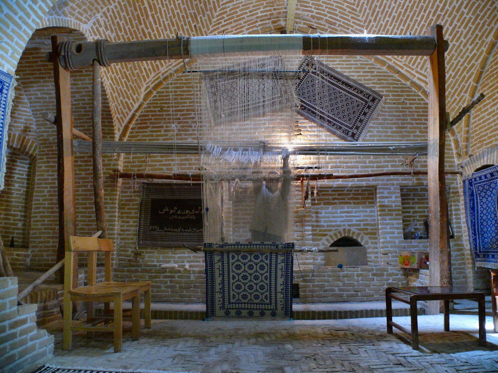 Traditional Persian carpet weaving loom in a restored caravanserai, Meybod, Iran